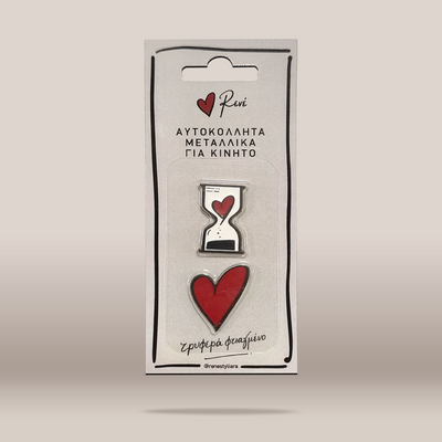 A packaged set of two enamel pins from the brand Renei, featuring a silver hourglass pin with a red heart and a solid red heart pin, both mounted on a white backing card with Greek text.