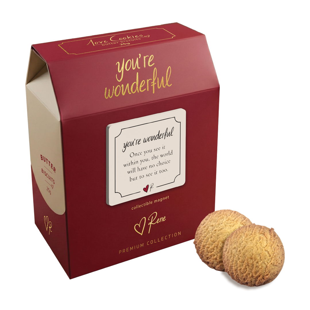 Red box with 'you're wonderful' text, two round brown objects, and a magnet on a white background