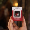 Hand holding a small red box with 'Pipia' branding against a blurred background