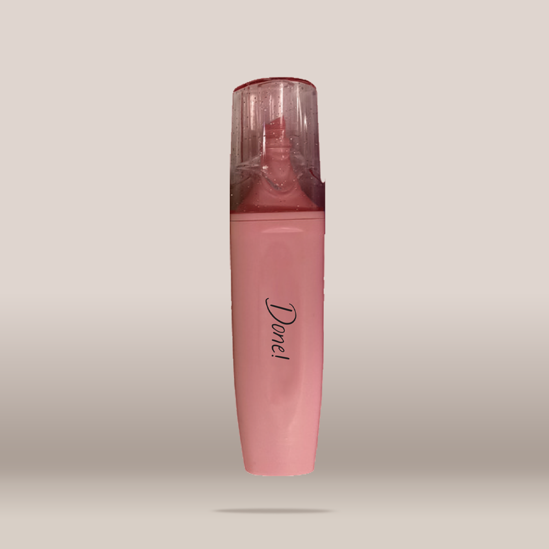 A pink cosmetic tube with a clear cap, featuring the brand name 'Done!' printed in black script on the front, set against a neutral beige background.