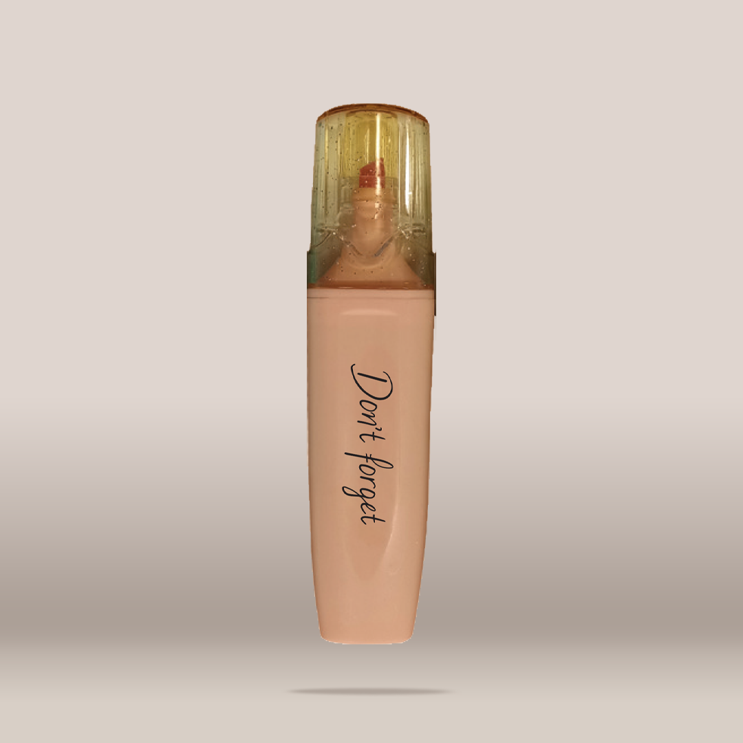 A single bottle of liquid foundation or concealer with a translucent cap, shown centered on a plain light gray background. The bottle is a warm nude beige shade with the words 'Don't forget' printed vertically in black script near the lower half.