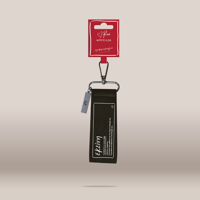 A black canvas keychain pouch with white text, attached to a silver carabiner and a red retail card labeled.