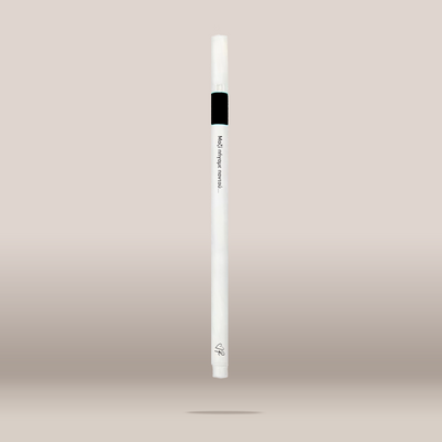 A white cosmetic pen-style applicator with a black band near the top and small printed text, shown centered against a soft beige gradient background.