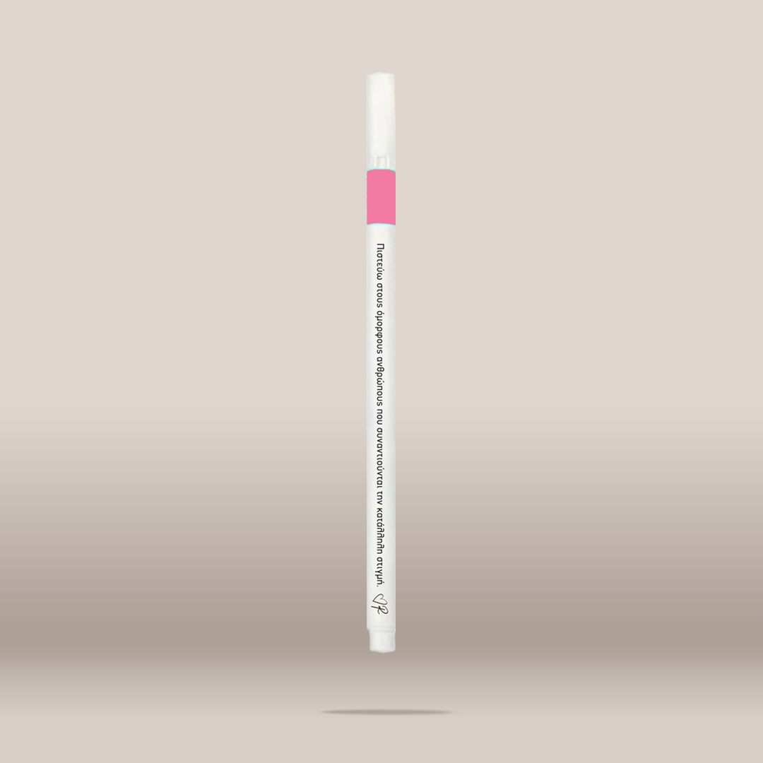 A single white cosmetic pen-style applicator with a pink band near the top and black printed text, shown centered against a soft beige gradient background.