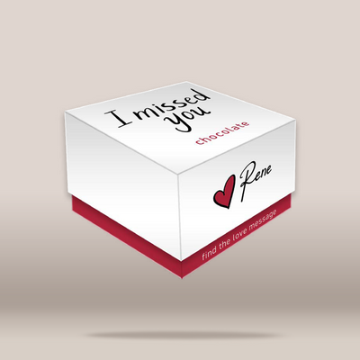 A white square chocolate box with a red base, floating on a beige gradient background. The top lid reads 'I missed you chocolate' in black and red text, and the front side shows a red heart and the name 'Rene' in black script.