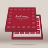 A red gift box set labeled 'Love Reasons 20 Föyos nou o ayétidou' with multiple small card or note compartments arranged on the lid and tray, photographed on a light beige background.