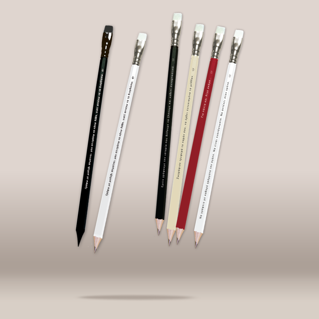 Six decorative pencils floating vertically against a plain beige background. The set includes black and white pencils, as well as beige, red, and white pencils, all with printed text and silver ferrules.