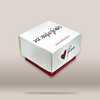 A white square gift box with a red base, featuring Greek text 'ΝΑ ΧΑΜΟΓΕΛΑΣ' in black and red script, and a red heart logo next to the name 'Rene' in white, shown on a light beige gradient background.
