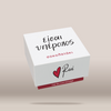A white square gift box with black and red printed text and a red heart logo, shown floating on a warm beige background. The top reads 'EISAI YPEROXOS' and the front shows the Revé brand name with a red heart logo and the phrase 'find the love message'.